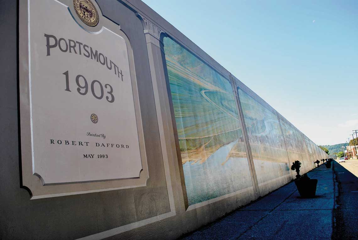 A large plaque on the left declares Porstmouth 1903, painted by Robert Dafford with the painted wall stretching into the distance